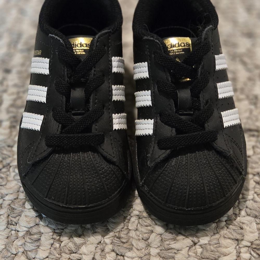Adidas Kids Black and White Sneakers with Gold Accents